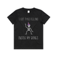 Black T-Shirt with a white skeleton wearing a purple and orange witch's hat. T-shirt says I got this feeling inside my bones.