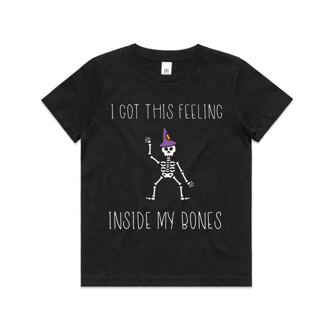 Black T-Shirt with a white skeleton wearing a purple and orange witch's hat. T-shirt says I got this feeling inside my bones.