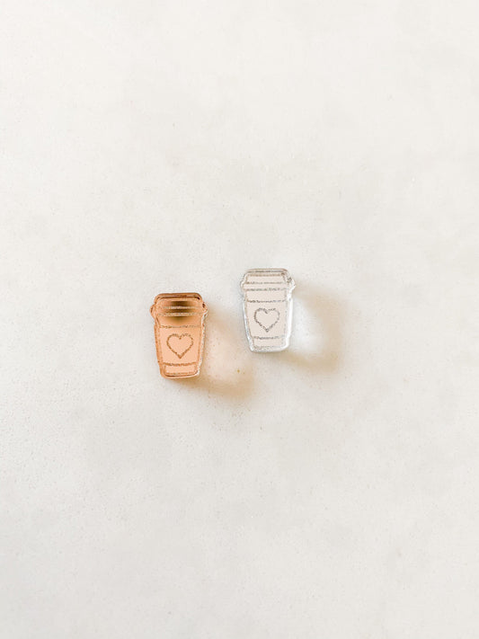 Left rose gold coffee earring with love heart and right is a silver mirror acrylic coffee cup earring with heart.